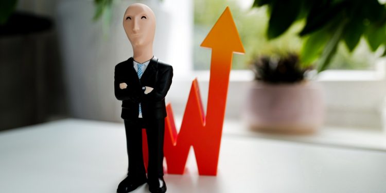 man in black suit jacket and black pants figurine